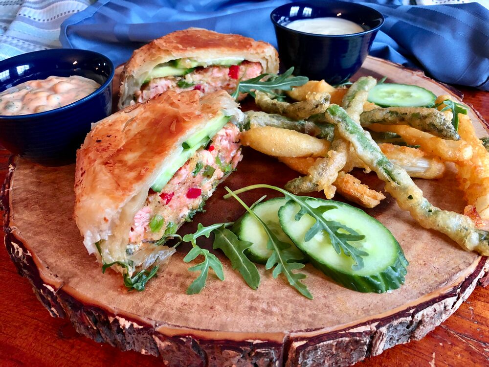 PHYLLO-WRAPPED SALMON BURGERS BATHED IN SPICY MAYO TARTER SAUCE WITH PARMESAN TEMPURA GREEN AND WHITE ASPARAGUS FRIES WITH LEMON AIOLI DIPPING SAUCE Beyond Burger and Fries...