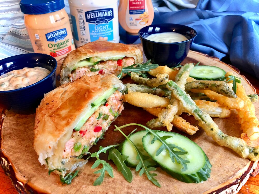PHYLLO-WRAPPED SALMON BURGERS BATHED IN SPICY MAYO TARTER SAUCE WITH PARMESAN TEMPURA GREEN AND WHITE ASPARAGUS FRIES WITH LEMON AIOLI DIPPING SAUCE Beyond Burger and Fries...
