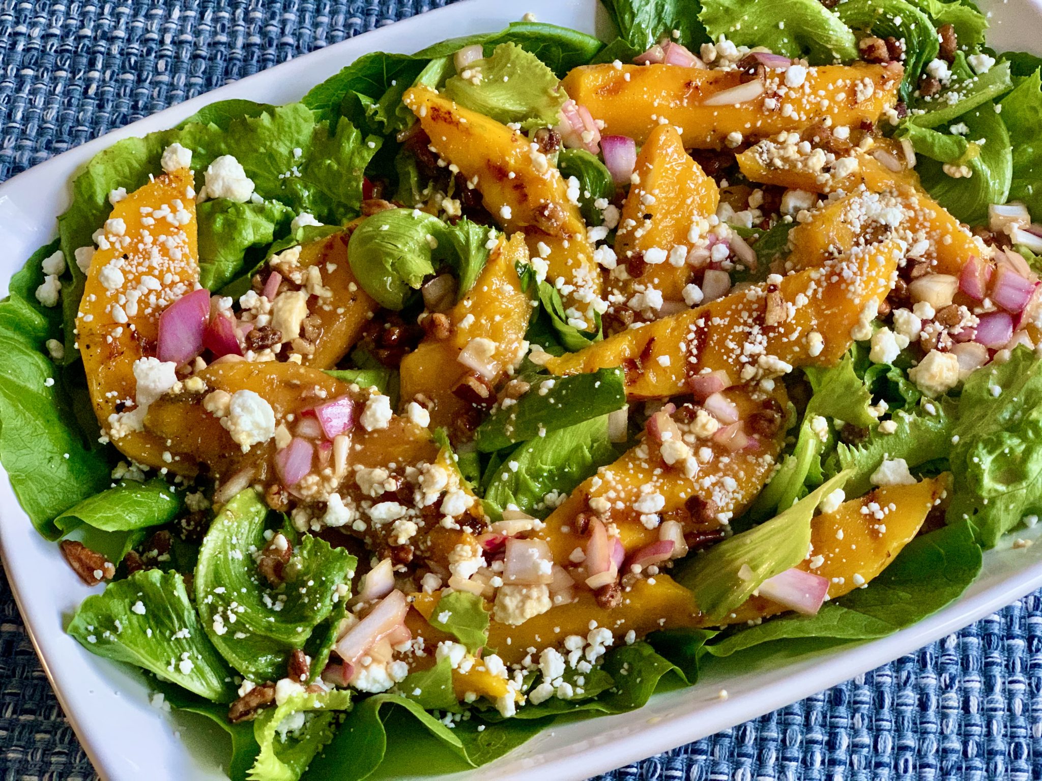 GRILLED MANGO AND GREENS SALAD WITH GOAT CHEESE AND HONEY BALSAMIC