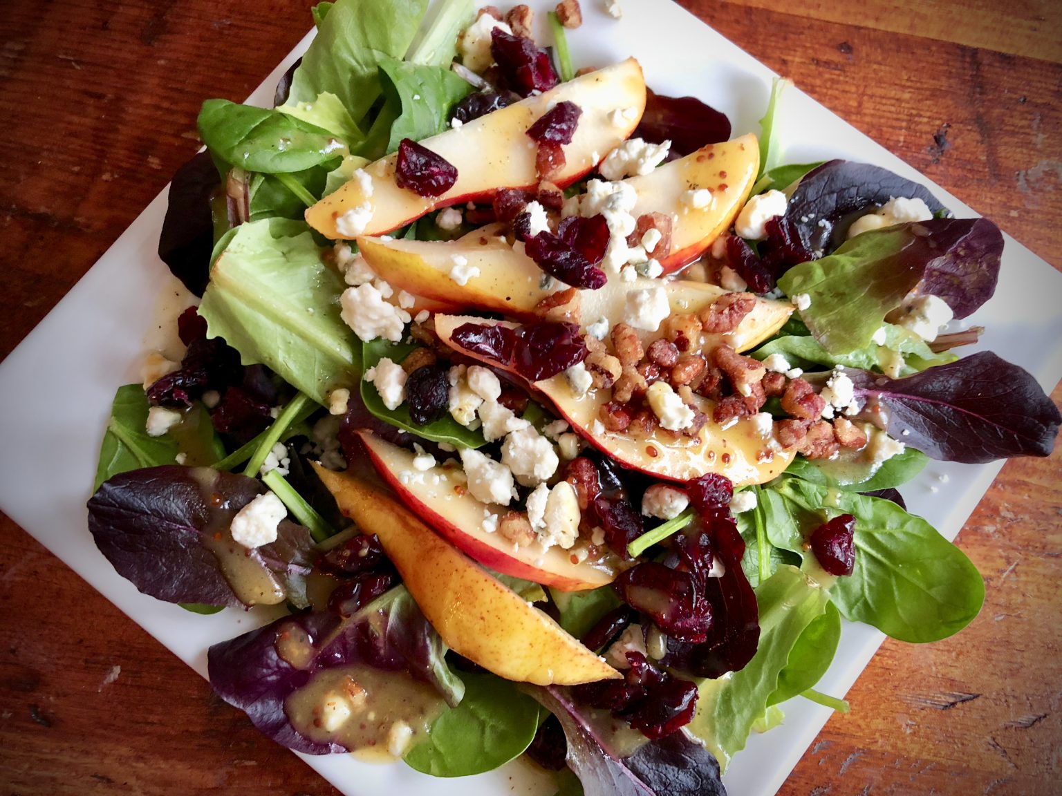 MIXED GREENS WITH PEARS, DRIED CRANBERRIES, AND CANDIED