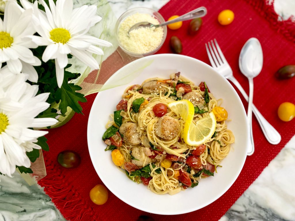 SCALLOPS IN PANCETTA PARMESAN CREAM SAUCE OVER ANGEL HAIR SCALLOPS IN PANCETTA PARMESAN CREAM SAUCE OVER ANGEL HAIR