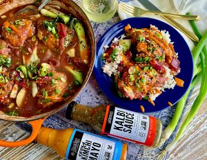 SWEET AND SPICY KOREAN CHICKEN THIGHS WITH PLUMS, ONIONS, AND BOK CHOY