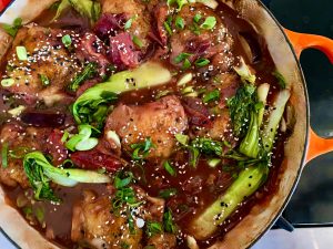 SWEET AND SPICY KOREAN CHICKEN THIGHS WITH PLUMS, ONIONS, AND BOK CHOY
