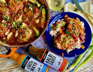 SWEET AND SPICY KOREAN CHICKEN THIGHS WITH PLUMS, ONIONS, AND BOK CHOY