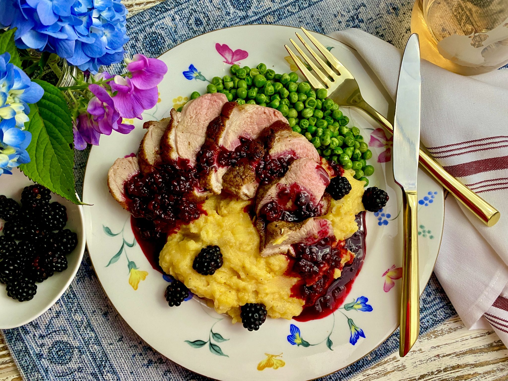 CAJUN DUCK BREAST WITH BLACKBERRY GINGER SAUCE OVER TWO TATER MASH