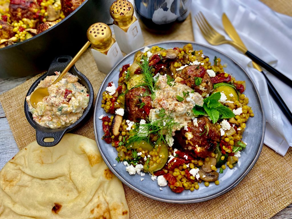 Mediterranean Lamb Meatballs Over Pearl Couscous Veggie Melange With Sun Dried Tomato Tzatziki