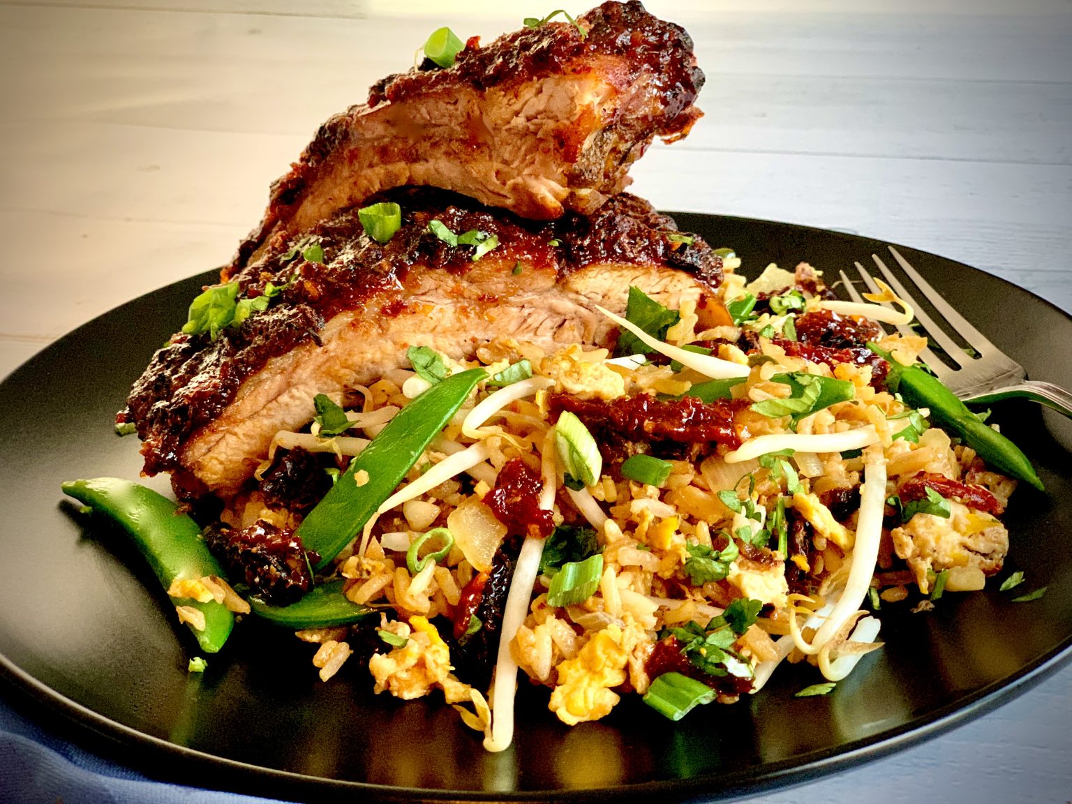 SWEET AND SPICY SUN DRIED TOMATO GLAZED RIBS OVER SUN DRIED TOMATO