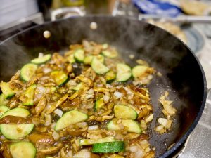 SCALLOP AND SPRING VEGETABLE NOODLE STIR FRY WITH SUNNY SIDE TOPPER