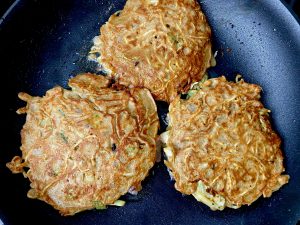 BACON AND NOODLE OKONOMIYAKI PANCAKES WITH SUNNY SIDE EGGS AND SRIRACHA MAYO