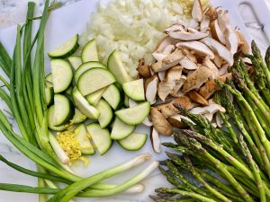 SCALLOP AND SPRING VEGETABLE NOODLE STIR FRY WITH SUNNY SIDE TOPPER
