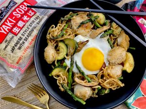 SCALLOP AND SPRING VEGETABLE NOODLE STIR FRY WITH SUNNY SIDE TOPPER