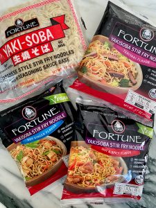 SCALLOP AND SPRING VEGETABLE NOODLE STIR FRY WITH SUNNY SIDE TOPPER