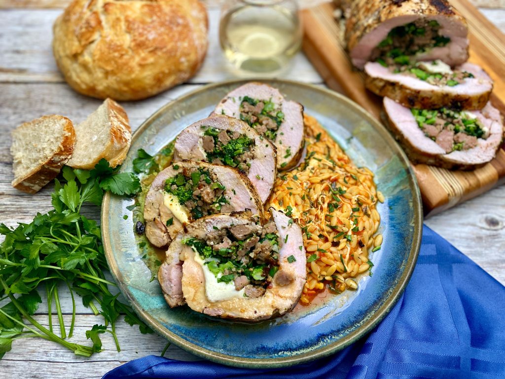 Italian Stallion Pork Loin Stuffed With Sausage, Broccoli Rabe, And Mozzarella Over Cheesy Tomato Orzo