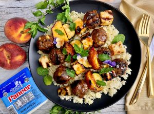 GLAZED LAMB MEATBALL, PANEER, PEACH, AND ZUCCHINI SKEWERS OVER COUSCOUS