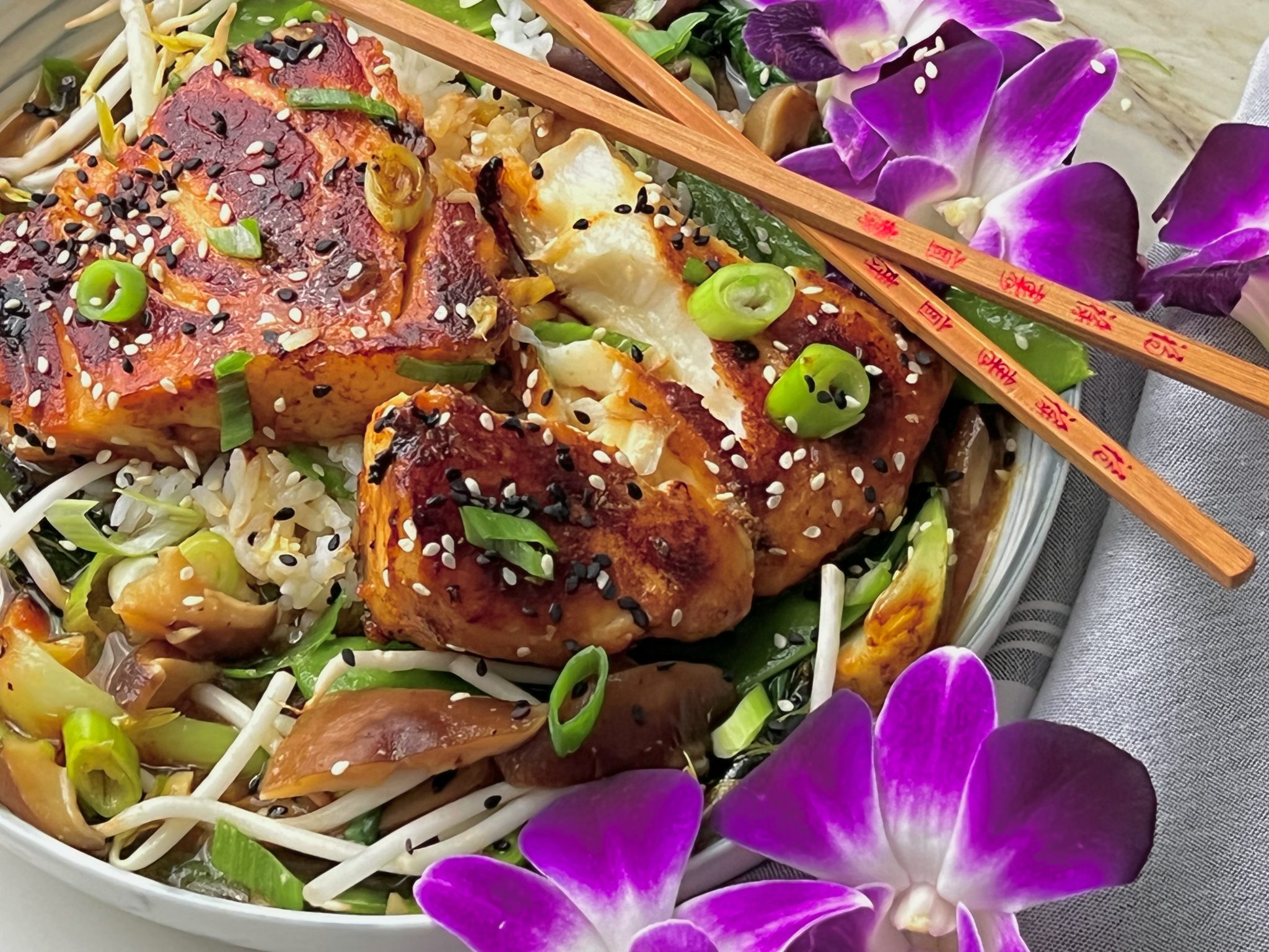 MISO GLAZED SEA BASS WITH MUSHROOMS, BOK CHOY, AND PEA POSDS IN SAKE