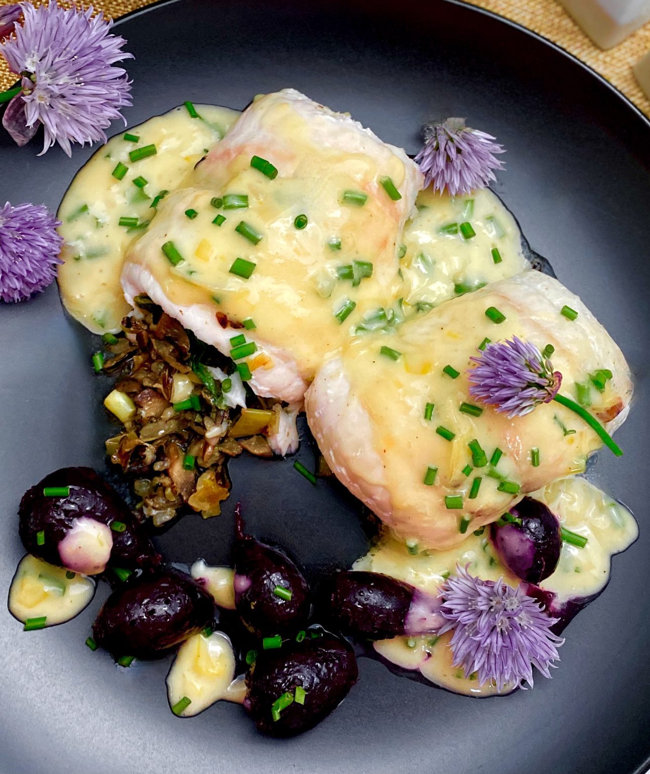 BAKED FLOUNDER WITH WILD RICE, LEEK, AND MUSHROOM STUFFING AND LEMON CHIVE BEURRE BLANC Dish